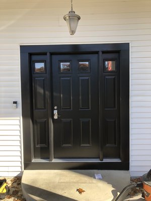 Beautiful black front door with custom aluminum work