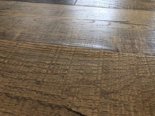 Laminate flooring melted and buckling.