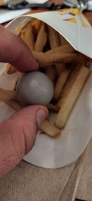 Found this in my French fries. I was the only one in line how could they miss this?