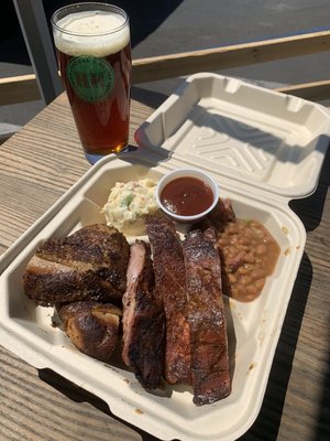 Pork rib and chicken combo with potato salad and brisket baked beans