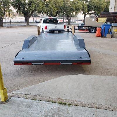 Extra wide drive over fender trailer. Fully equipped with winch and tools.