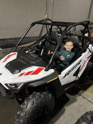 My son enjoying his new RZR from Malcolm smith!