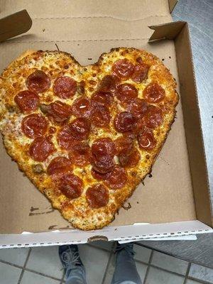 Heart Shaped pizza with light pizza sauce, light Italian sausage, pepperoni, and mozzarella and three cheeses!! Happy Valentine's Day!!