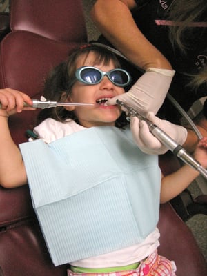 My daughter getting her teeth cleaned.