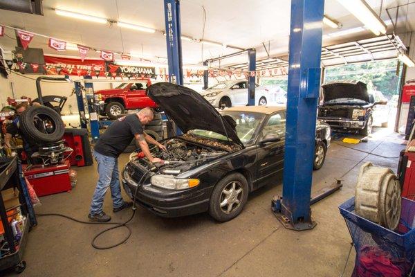 Mechanic at Faulkenburg Automotive working on a customers car.