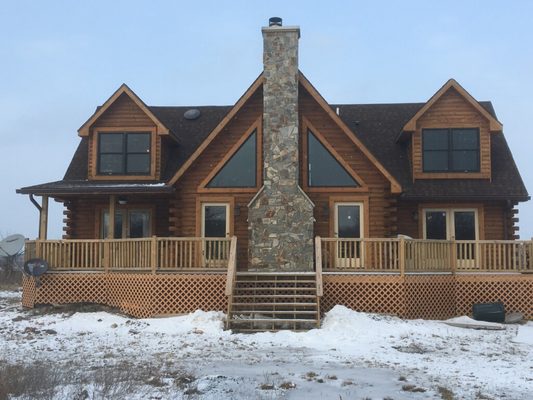 Log Cabin with Mountain Stone fireplace.