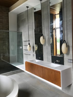 custom integral seamless floating vanity with integral shower bench