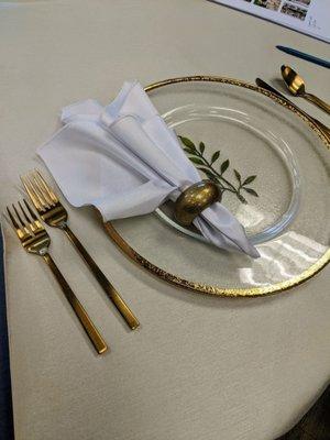 Staging a table setting for wedding planning with their rental items