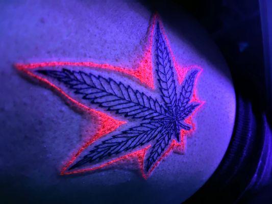 pot leaf UV ink tattoo