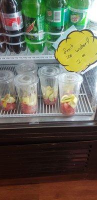 Cut up fruit cup grabs for water infusion.