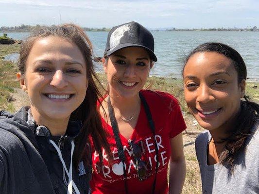 Darian, Vicky, and Brenda volunteering at the Martin Luther King Jr. Regional Shoreline for Save the Bay!