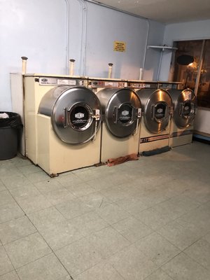 Washing machines in the front of the building.