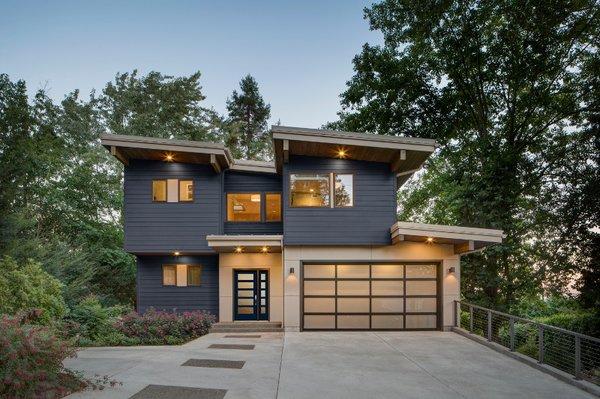 Absolutely stunning design. the casement and picture window mix allows in so much light and paired with a shaker impact door entrance!