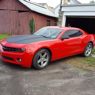 Carmine Red wrap with Carbon fiber accents on a Camaro