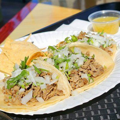 3 carne asada tacos, with a little cup of green salsa - authentic, simple, excellent