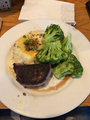 A six oz sirloin, medium rare with a side of fully loaded mashed potatoes and steamed broccoli.