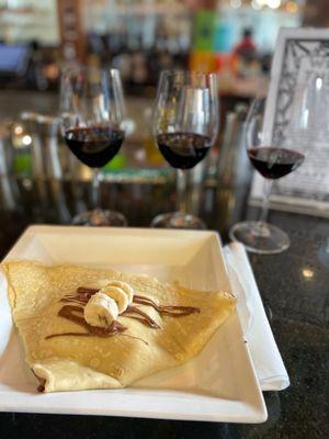 Banana Nutella crepe and delicious red wine to go with it.