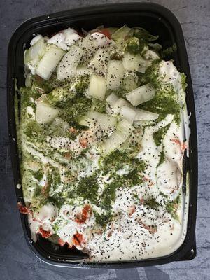 Chicken over rice, white onions, tomatoes, extra white and extra green sauce.