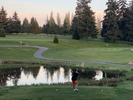 Teeing off on the par 3 of the 14th hole, and I made it over the water!!!