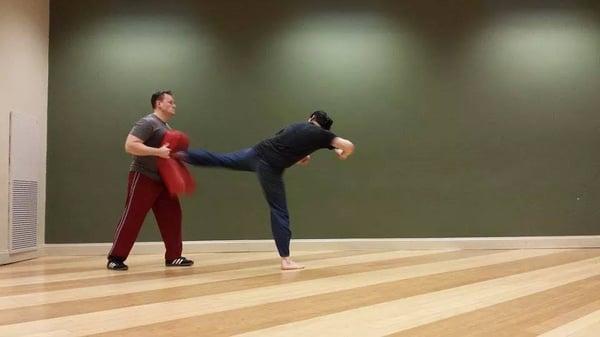 Student, Richard, training kicks as part of the JKD curriculum