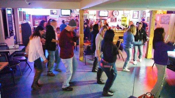 Learning the "Cupid Shuffle" at The Islander!