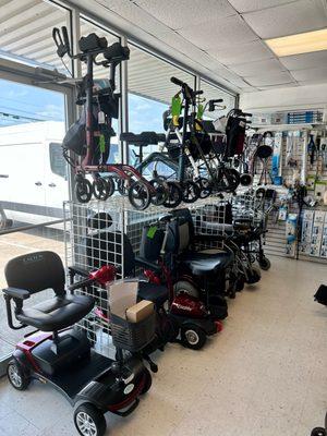 Mobility Equipment on display in-store. Scooters, Walkers, Wheelchairs, Power Wheelchairs, Transport Chairs, Knee Scooters... etc.