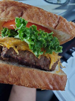 The burger - side profile. The consistency is more like meat loaf or a steamed burger, but it's so good!