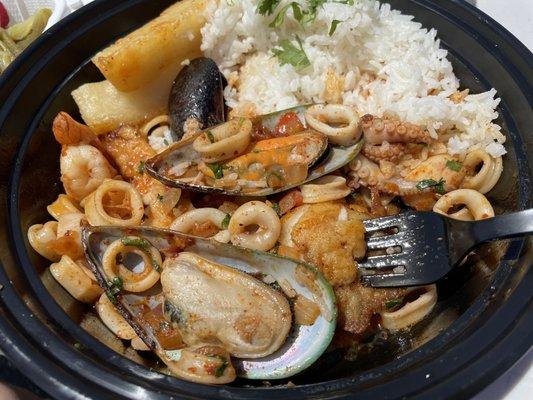 Pescado A Lo Macho Fish filet topped with (seafood) shrimp, calamari, mussels, octopus + rice & fried yuca