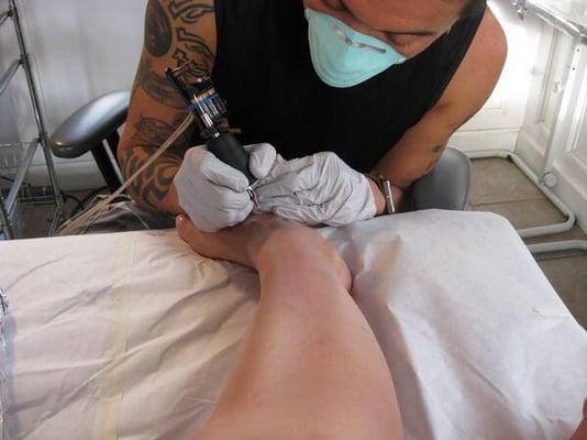 Roland tattooing my foot!