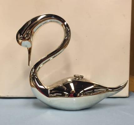 A spray chromed (silver mirrored) blown glass swan.