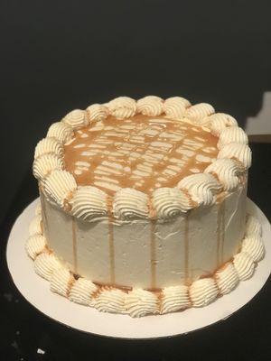 Chocolate Cake with white chocolate icing drizzled in caramel sauce.