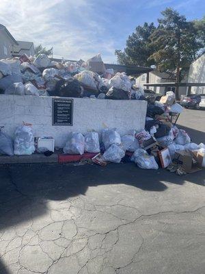 Trash has not been picked up in two weeks, multiple dumpsters across property