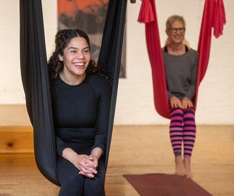 Smiles are always part of aerial yoga class!