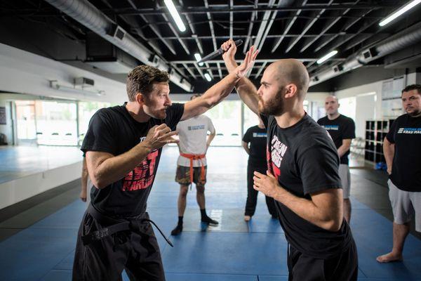 Master Kemmer teaching 360 defenses to the Krav Maga class.