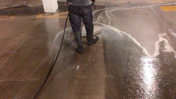 Pressure washing a parking garage