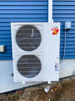 Modern Energy Mitsubishi Install of 42k BTU outdoor condenser for heat pump system.