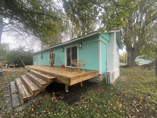 Far corner, new deck, steps, sliding glass door, 2nd mini split, new electrical, four windows & back door to new addition.