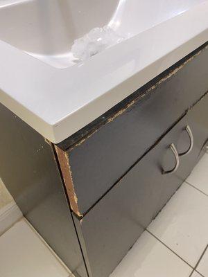 Water logged bathroom cabinets.