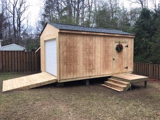 Storage shed with roll up door