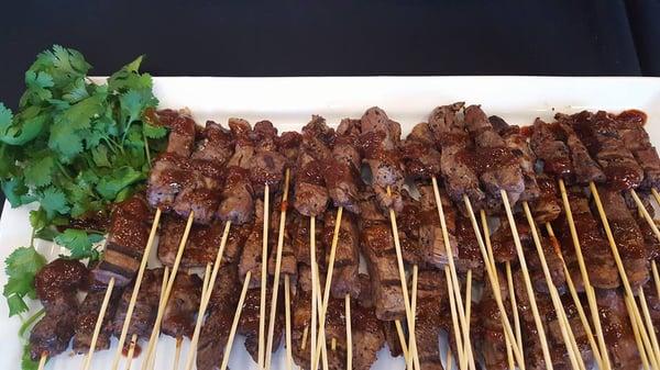 Beef tenderloin skewers with pomegranate barbecue sauce