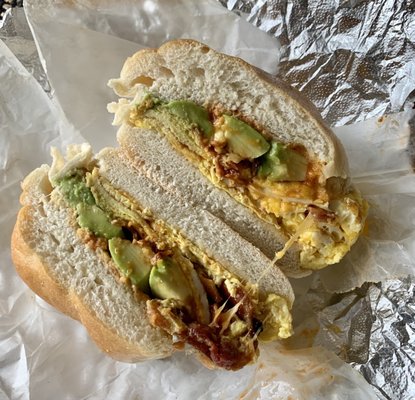 Bacon, egg, cheese and avocado on a roll