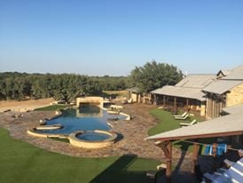 Custom Pool with swim up bar, waterfall, and spa