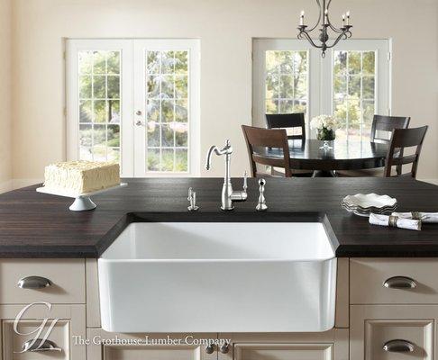 This traditional kitchen designed by The Shadowlight Group features a Grothouse Edge Grain kitchen island.