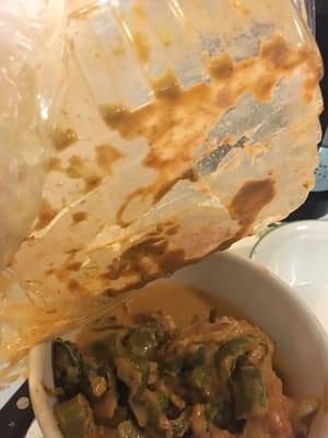 Beware take out customers-- pic of Take out container melted by Panang curry.  Pieces of plastic in the food!