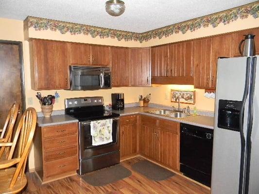 Spacious updated kitchen with breakfast bar.  Some appliances are included.