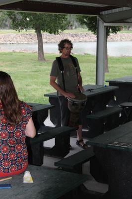 Kerry leading a drum circle in the park in Atwood, KS