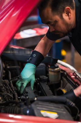 One of our Certified Technicians working on a customers vehicle.