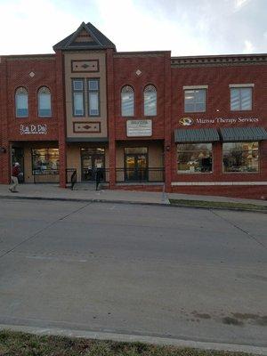 This is the front of our building when you are on Corona Rd. Enter through the office suite doors and then head upstairs to the third floor.