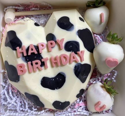 ** Cow prints chocolate heart breakable with fully white chocolate dipped strawberries **