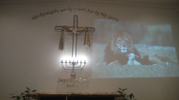 The Lion of the Tribe of Judah and the Lamb of God who takes away the sin of the world.